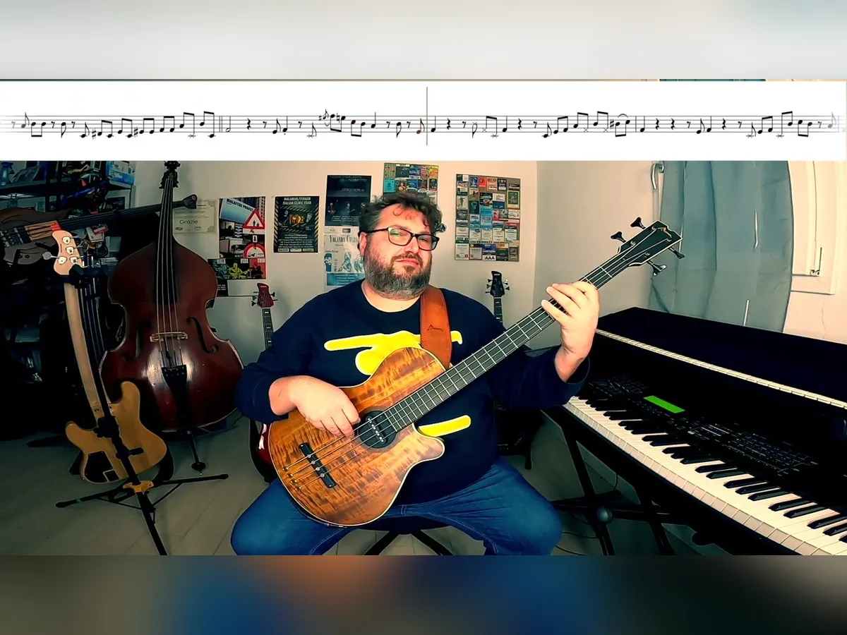 Federico Malaman playing bass with a piano behind him