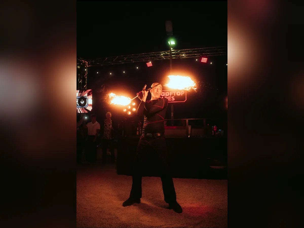 Fire breather performing at a Rooftop Tapes DJ night